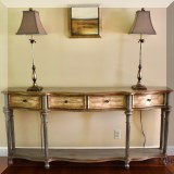 F09. Painted three-drawer console table. 34”h x 70”w x 12”d 